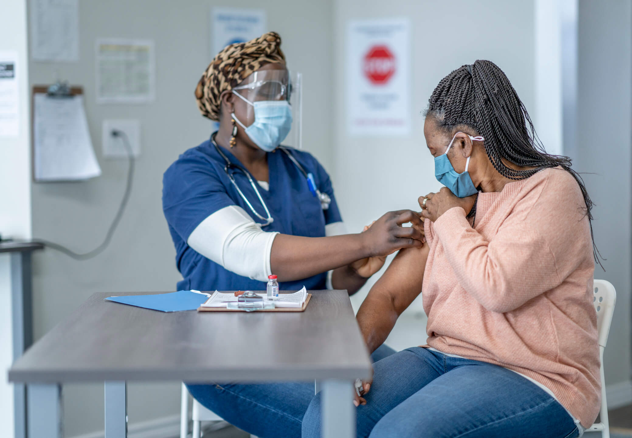 A nurse taking a patient's blood pressure