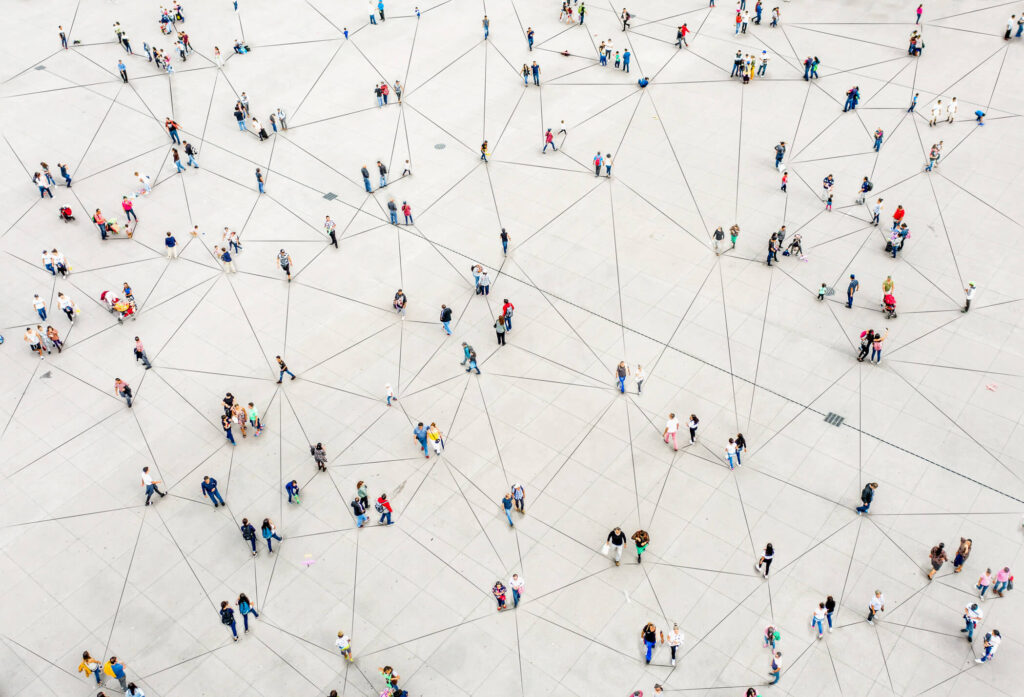 Crowd of people connected by lines on the ground